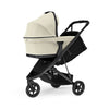 Thule Spring baby bassinet in soft beige, designed for newborns on the go.