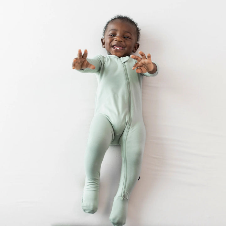 Naptime made better in Thyme Kyte Baby Zippered Footie, comfy baby pajamas for all seasons.