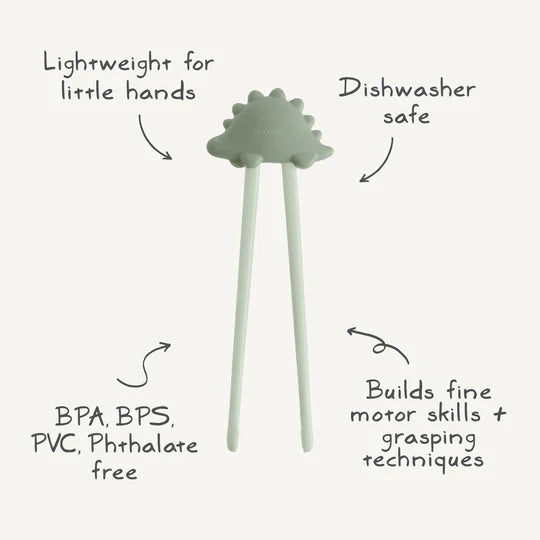 Mushie Training Chopsticks dino infographic - features guide showing connector topper, grip alignment, and BPA-free materials