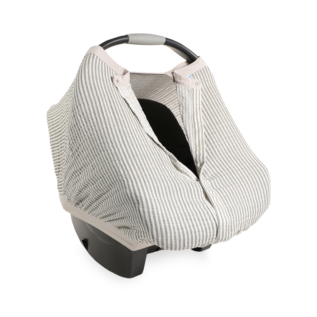 Close-up of the Little Unicorn Cotton Muslin Car Seat Canopy - Grey Stripe highlighting soft, breathable fabric for baby car seat comfort.