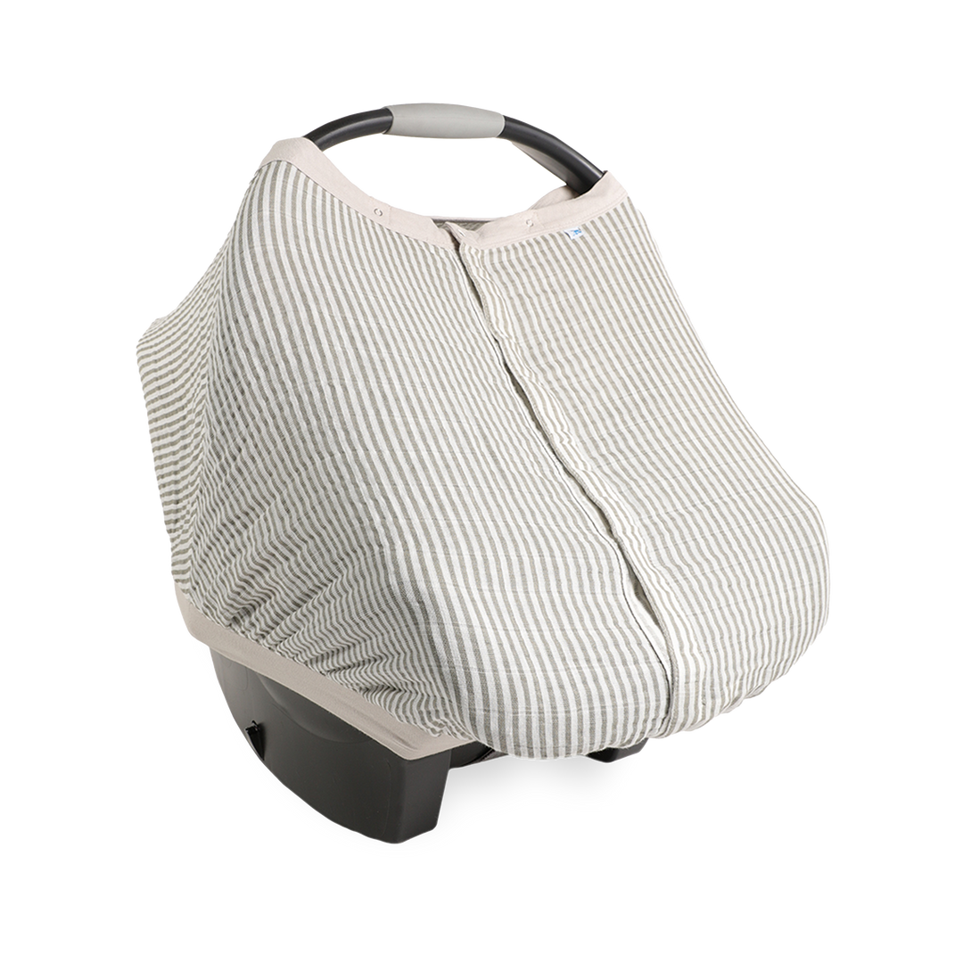 Little Unicorn Cotton Muslin Car Seat Canopy - Grey Stripe shown in a modern neutral stripe, perfect for stylish car seat canopy coverage.
