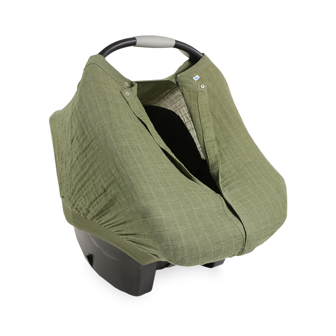 Close-up of the Little Unicorn Cotton Muslin Car Seat Canopy - Fern highlighting lightweight fabric for cozy baby car seat comfort.