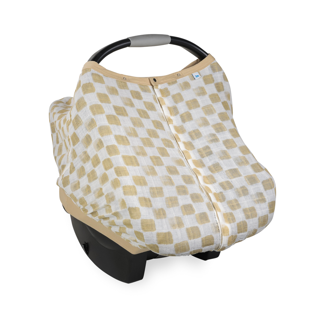 Little Unicorn Cotton Muslin Car Seat Canopy - Adobe Checker shown in a warm checkerboard design, perfect for stylish car seat canopy protection.
