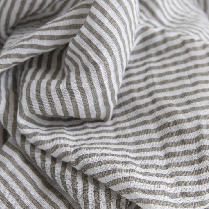 Lightweight muslin swaddle by Little Unicorn, featuring the Watercolor Roses design.