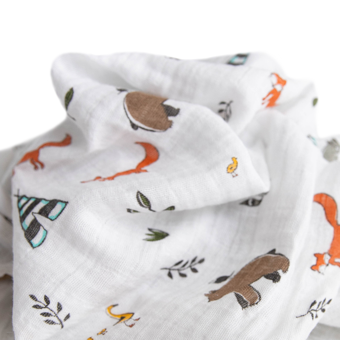 Cozy Forest Friends muslin blankets by Little Unicorn, ideal for gentle infant swaddling.