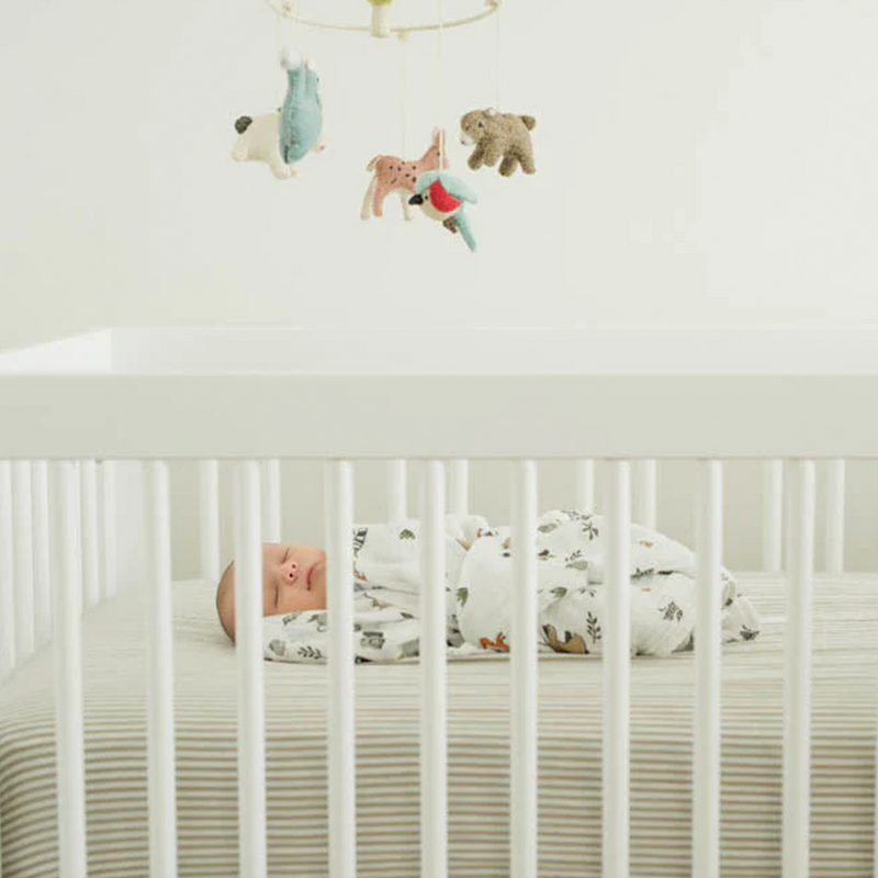 Infant muslin blankets by Little Unicorn in Forest Friends, perfect for cozy swaddling.