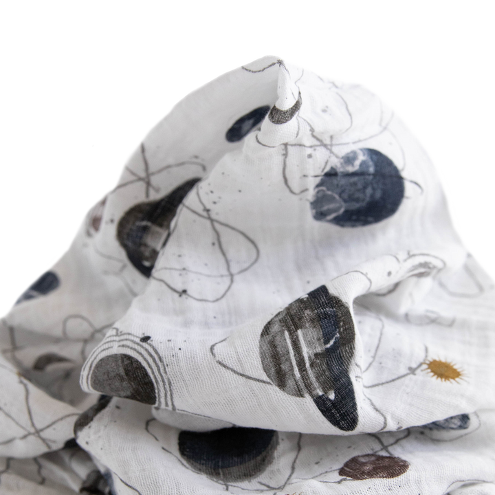 Planetary muslin blanket by Little Unicorn, breathable and gentle for baby comfort.