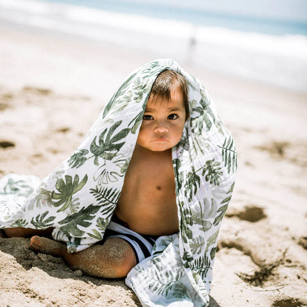 Tropical Leaf Cotton Muslin Swaddle Blanket by Little Unicorn, versatile muslin baby blankets for comfort.