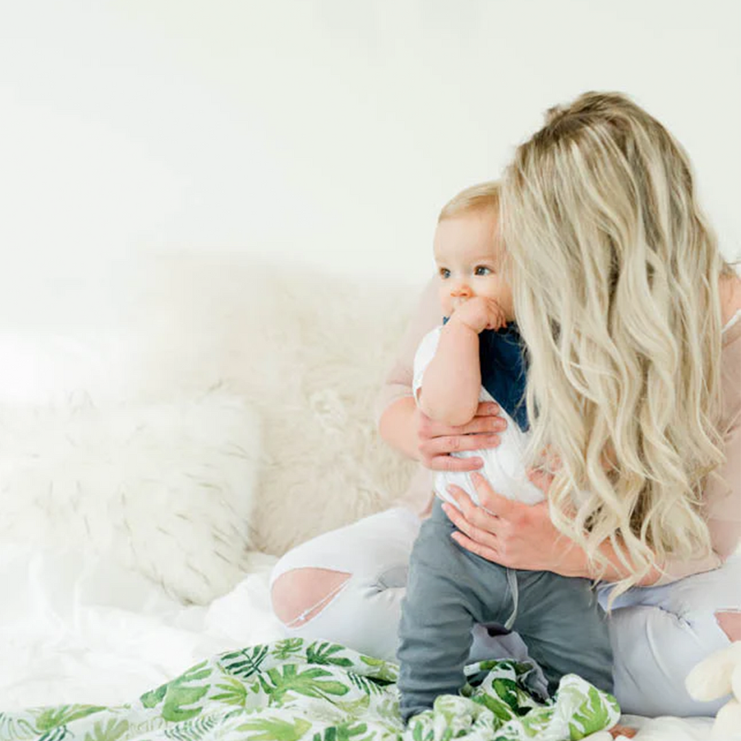 Little Unicorn muslin swaddle in Tropical Leaf, breathable swaddle cloth muslin for happy, cozy babies.