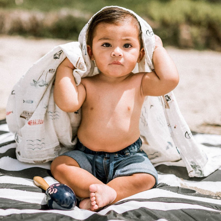 Wrap your baby in Little Unicorn Shark 2 Muslin Swaddle Blanket 3 Pack, swaddling muslin blanket