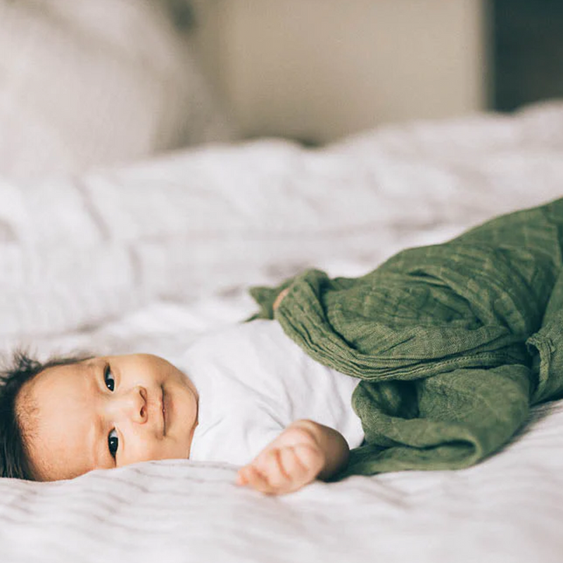 Infant muslin blankets by Little Unicorn in Fern, ideal for gentle swaddling.