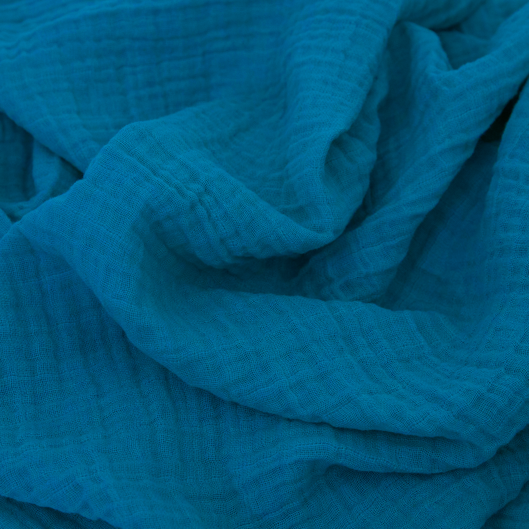 Wrap your baby in Little Unicorn Dino Friends 2 Muslin Swaddle Blanket 3 Pack, swaddling muslin blanket