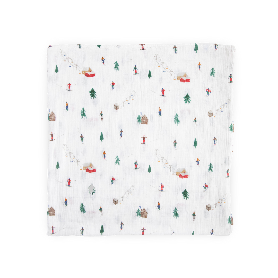 Little Unicorn muslin swaddle in Powder Party print, lightweight and breathable baby blanket.