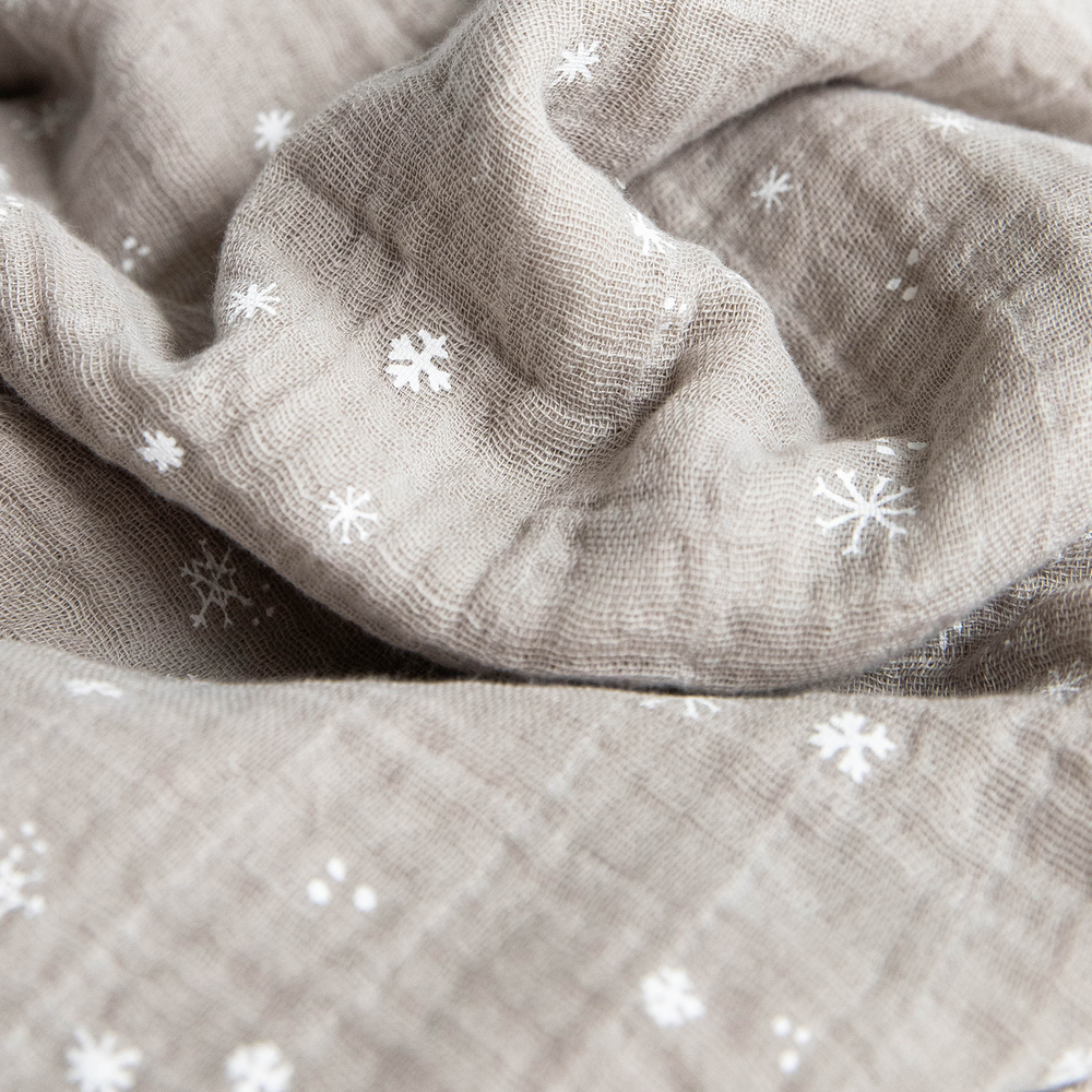 Cozy Little Unicorn Snow Flurries muslin blankets, ideal for gentle infant swaddling.
