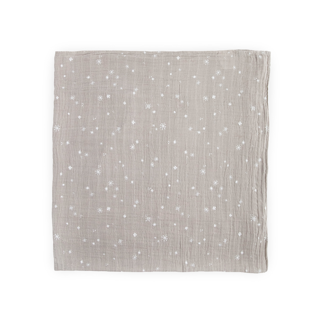 Little Unicorn muslin swaddle in Snow Flurries print, lightweight and breathable baby blanket.