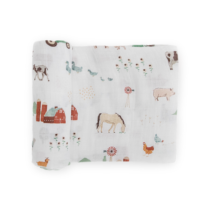 Little Unicorn Cotton Muslin Swaddle Blanket – Farmyard featuring soft muslin for swaddling newborns.