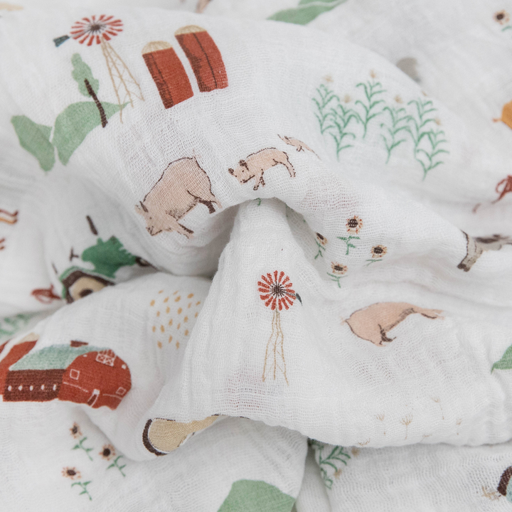 Cozy Farmyard muslin swaddle by Little Unicorn, perfect as an infant muslin blanket.