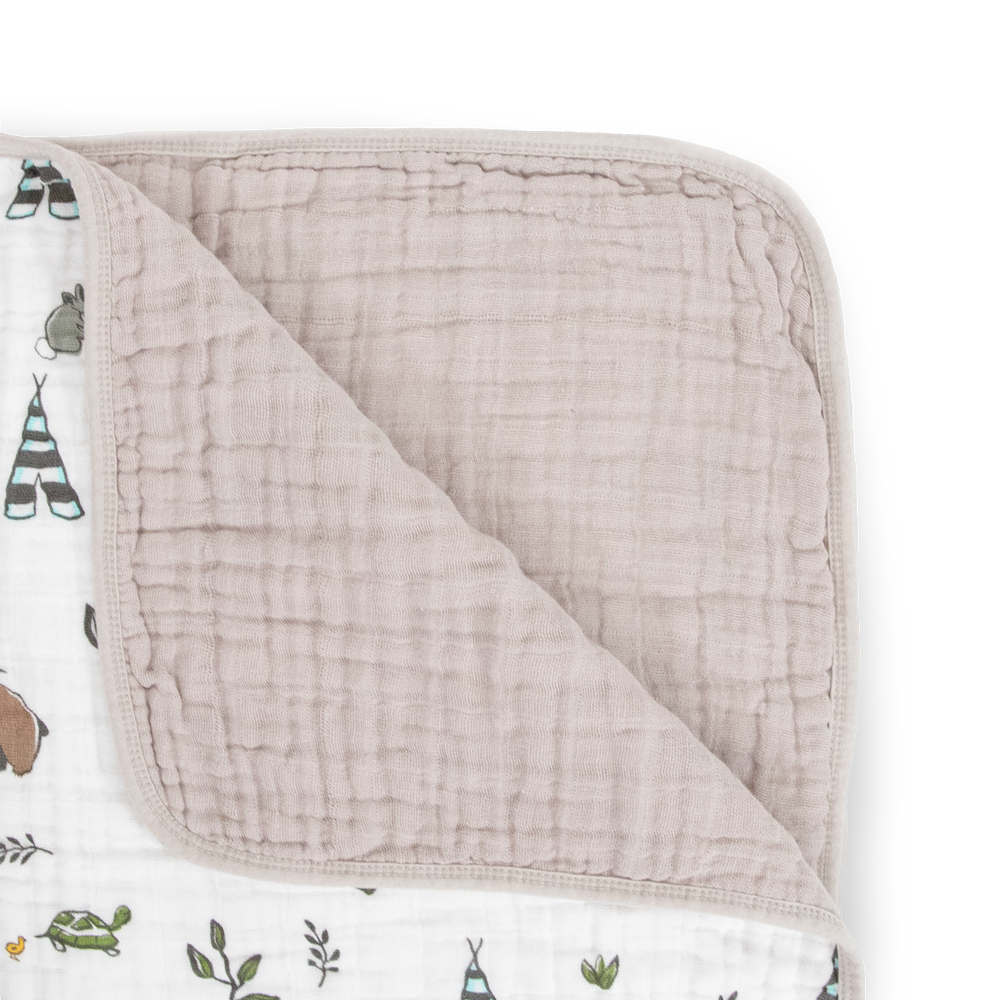 The Little Unicorn Original Cotton Muslin Quilt - Forest Friends displayed open, a breathable muslin blanket perfect for everyday use.