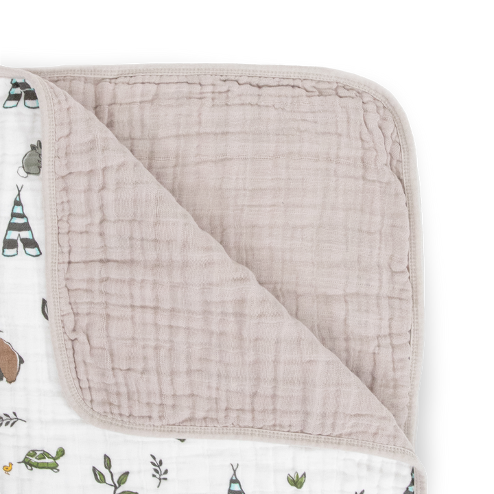The Little Unicorn Original Cotton Muslin Quilt - Forest Friends displayed open, a breathable muslin blanket perfect for everyday use.