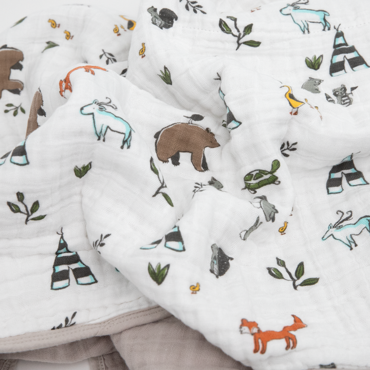 Beautifully detailed Little Unicorn Original Cotton Muslin Quilt - Forest Friends, crafted from cotton layers for a lightweight muslin quilt.