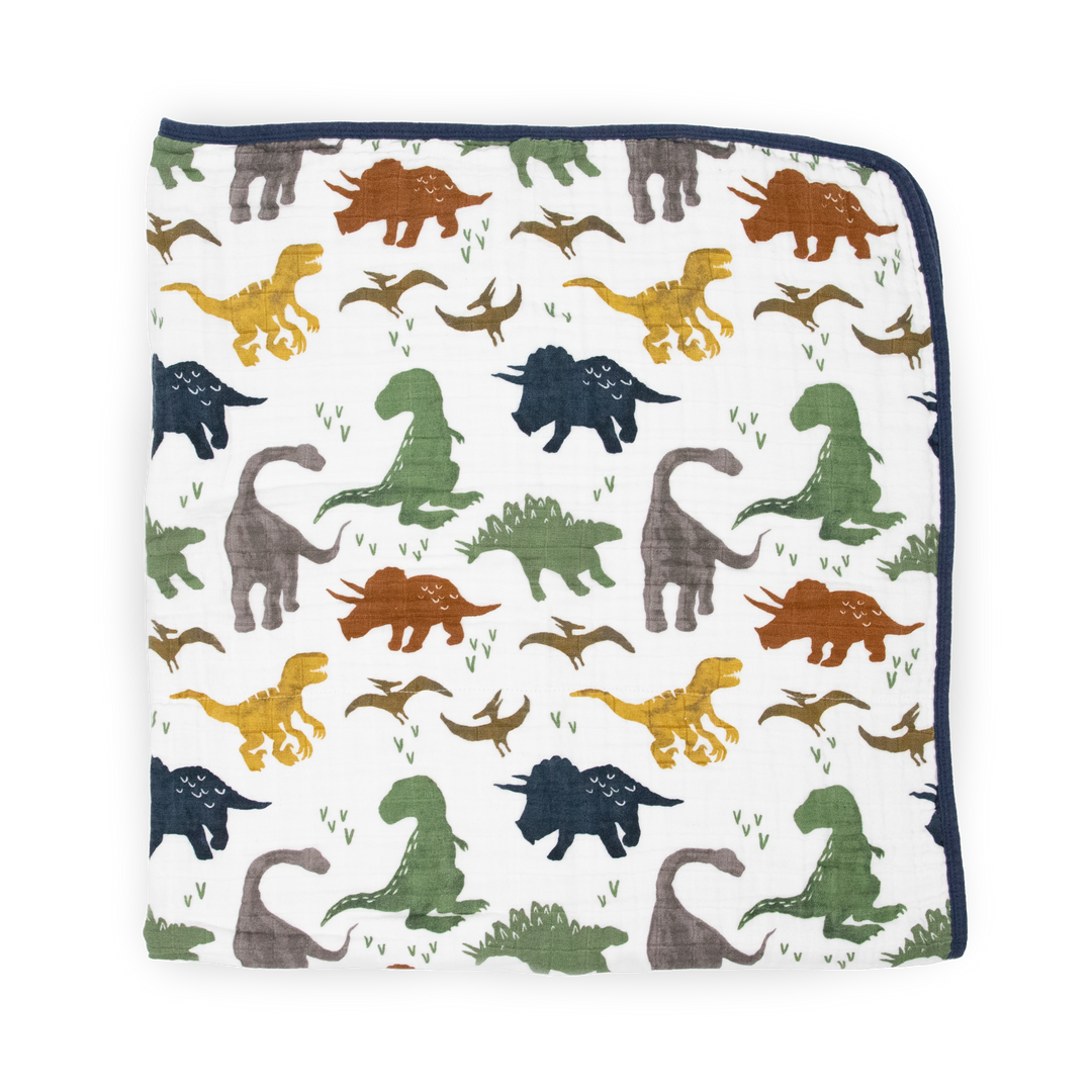 Close-up of Little Unicorn Original Cotton Muslin Quilt - Dino Friends, showing premium cotton texture of these soft muslin baby blankets.