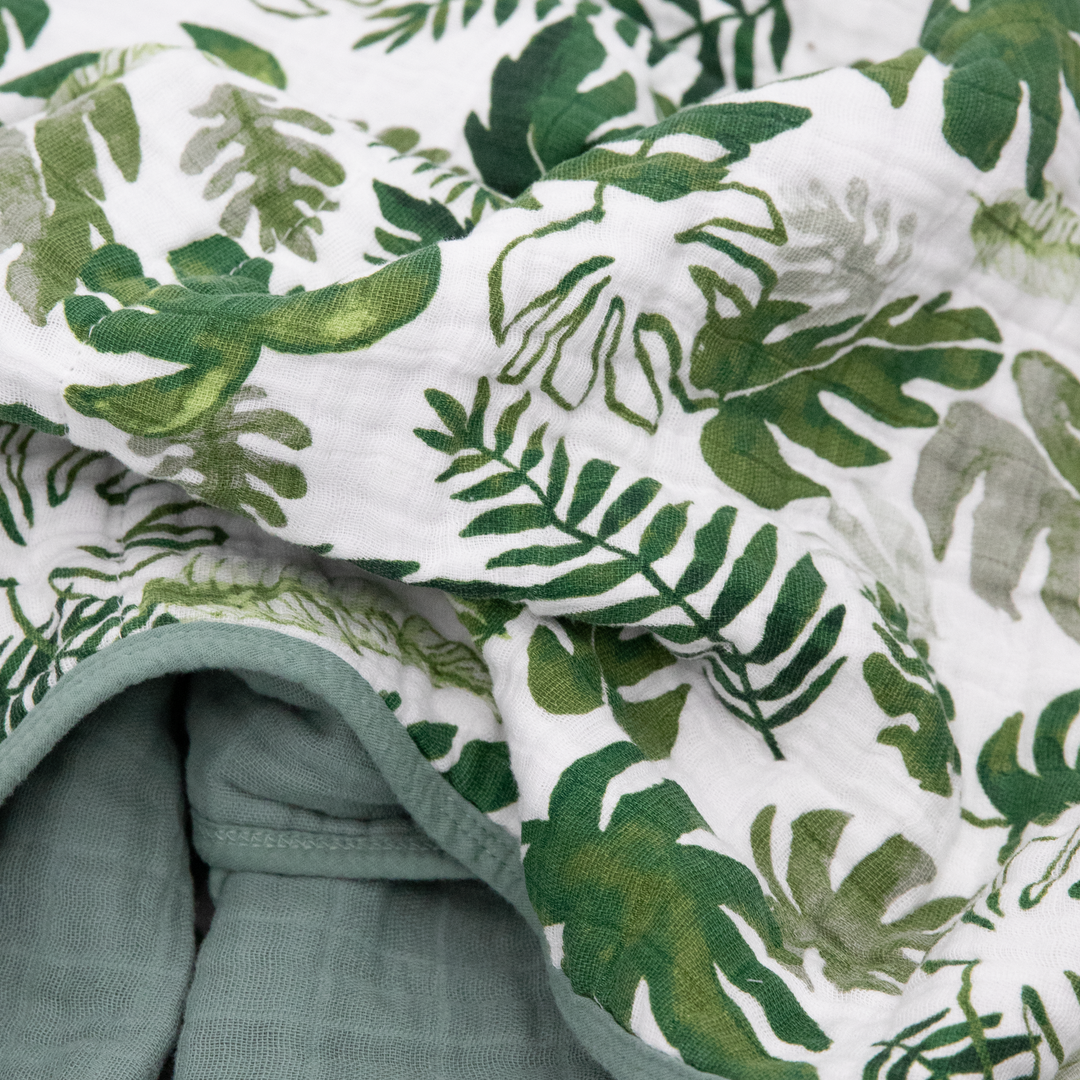 Beautifully crafted Little Unicorn Original Cotton Muslin Quilt - Tropical Leaf, designed for comfort with a tropical-themed muslin quilt style.