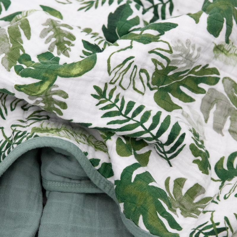 Beautifully crafted Little Unicorn Original Cotton Muslin Quilt - Tropical Leaf, designed for comfort with a tropical-themed muslin quilt style.