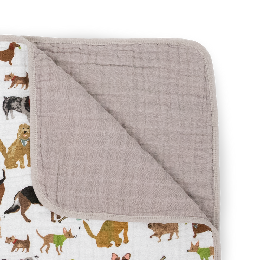 The Little Unicorn Original Cotton Muslin Quilt - Woof displayed open, a lightweight muslin blanket perfect for snuggles and naps.