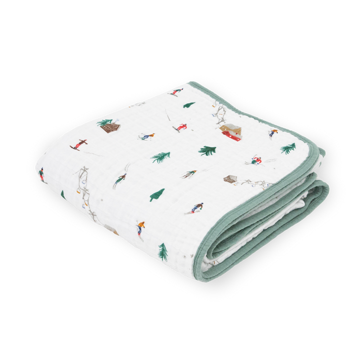 Little Unicorn Original Cotton Muslin Quilt - Powder Party shown folded neatly, the perfect baby blanket for cozy comfort and soft style.