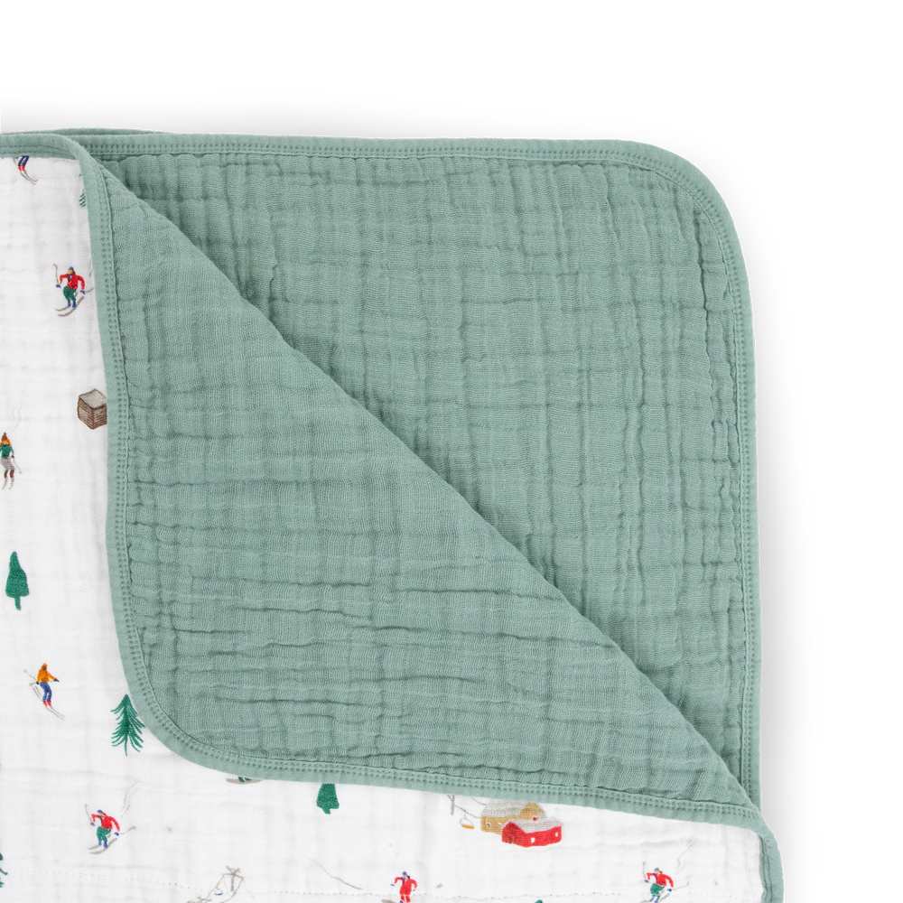 The Little Unicorn Original Cotton Muslin Quilt - Powder Party displayed in full, a lightweight muslin blanket ideal for everyday snuggles.