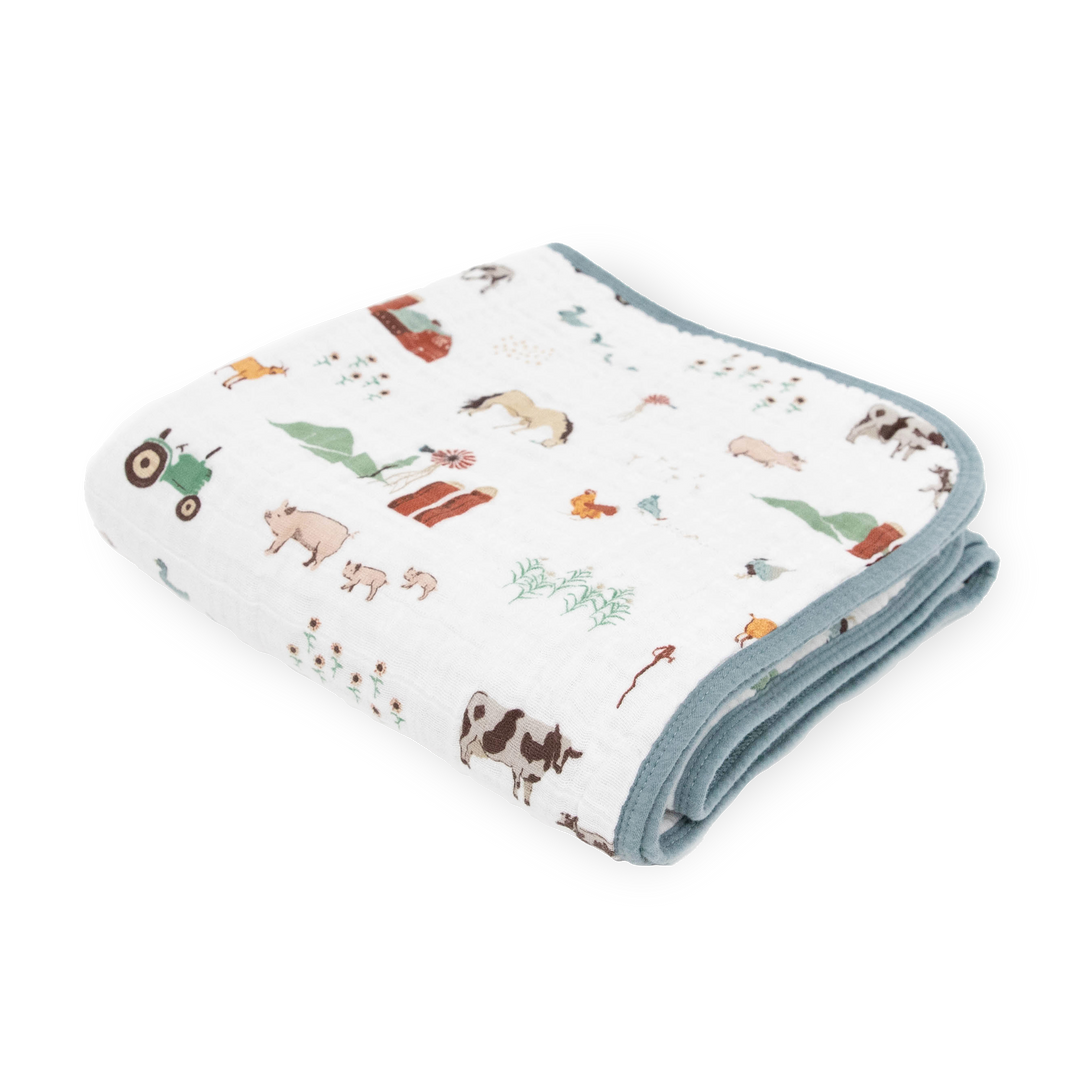 Little Unicorn Original Cotton Muslin Quilt - Farmyard neatly folded, a soft and cozy baby blanket perfect for everyday snuggles.