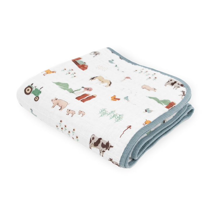 Little Unicorn Original Cotton Muslin Quilt - Farmyard neatly folded, a soft and cozy baby blanket perfect for everyday snuggles.