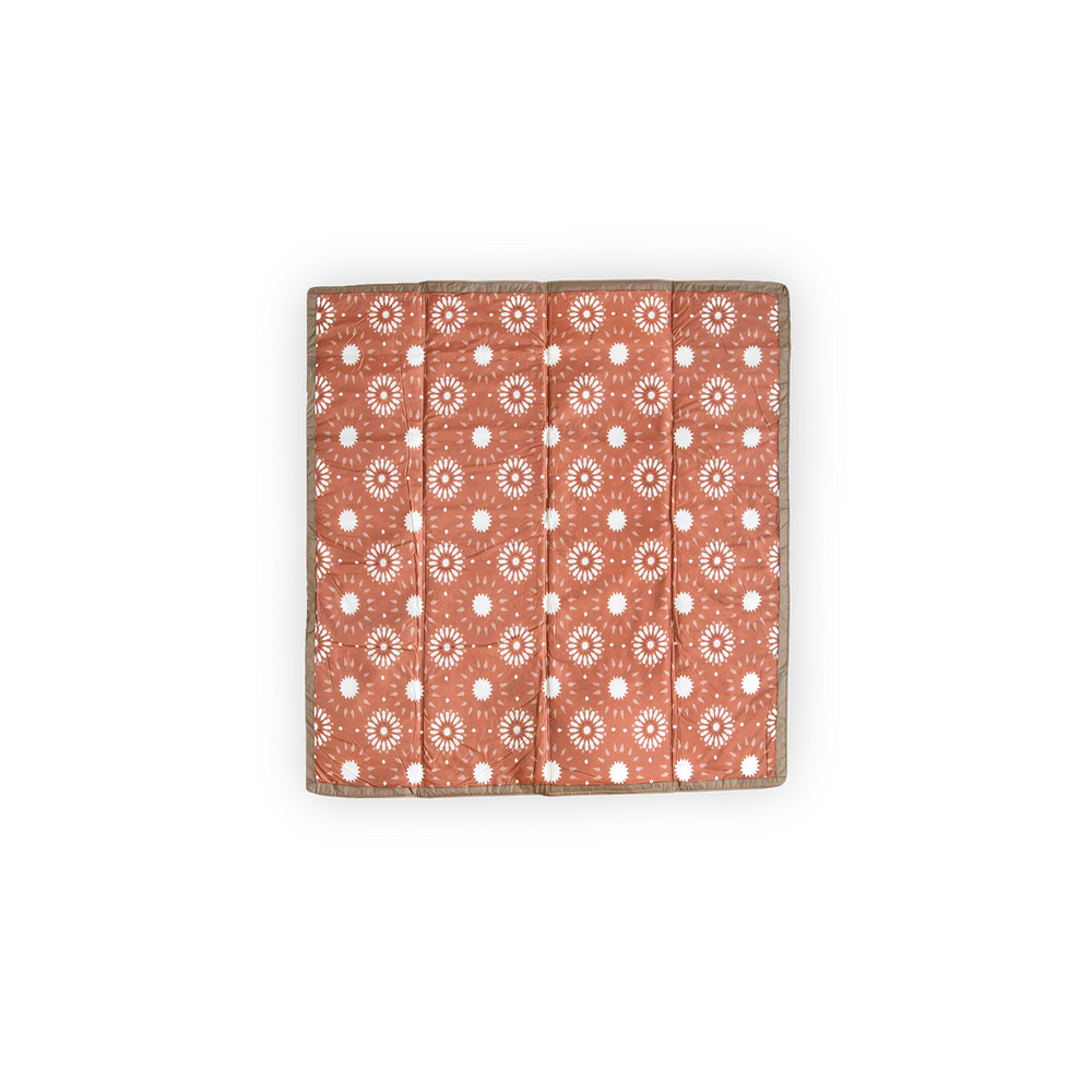 Little Unicorn Outdoor Blanket - Sun Baked draped on grass, soft and durable outdoor blankets perfect for family fun.