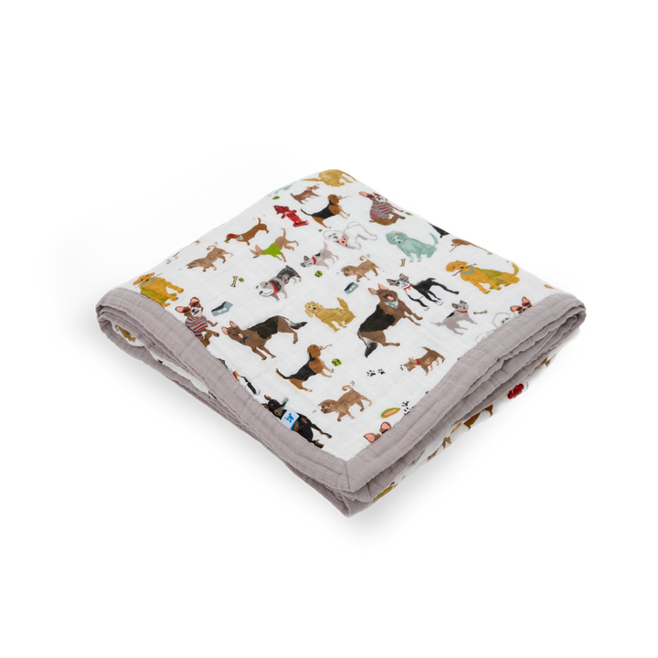 Make nap time special with the Little Unicorn Cotton Muslin Quilted Throw - Woof, a gentle muslin quilt.