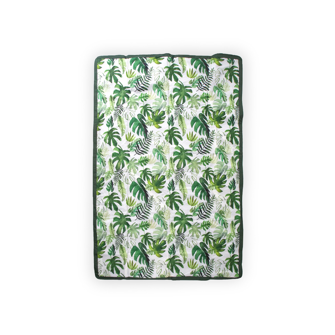Foldable and cozy, Little Unicorn Outdoor Blanket - Tropical Leaf is the best outdoor blanket for park or beach outings.