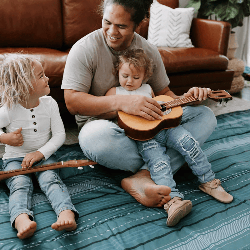 Little Unicorn Shoreline Stripe outdoor blanket laid out, premium waterproof outdoor blanket for all-weather use