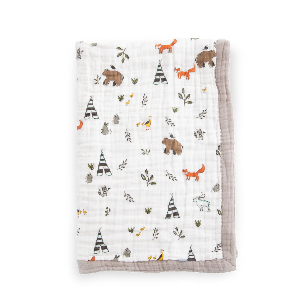Little Unicorn Cotton Muslin Baby Quilt - Forest Friends shown with playful woodland design, a cozy baby blanket for every season.