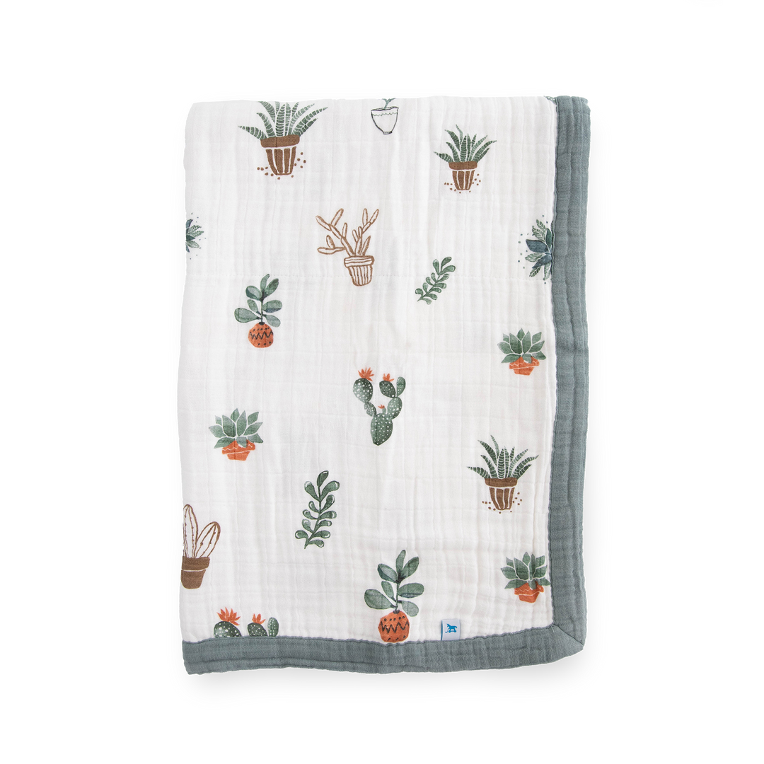 Little Unicorn Cotton Muslin Baby Quilt - Prickle Pots shown in a playful cactus print, perfect for a cozy and stylish baby blanket.