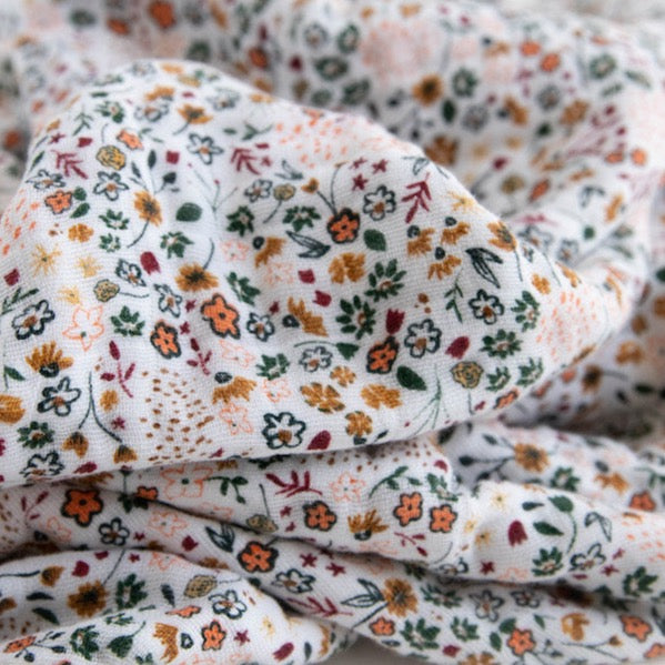 Elegant Little Unicorn Cotton Muslin Baby Quilt - Pressed Petals displayed folded neatly, crafted from lightweight muslin blankets.