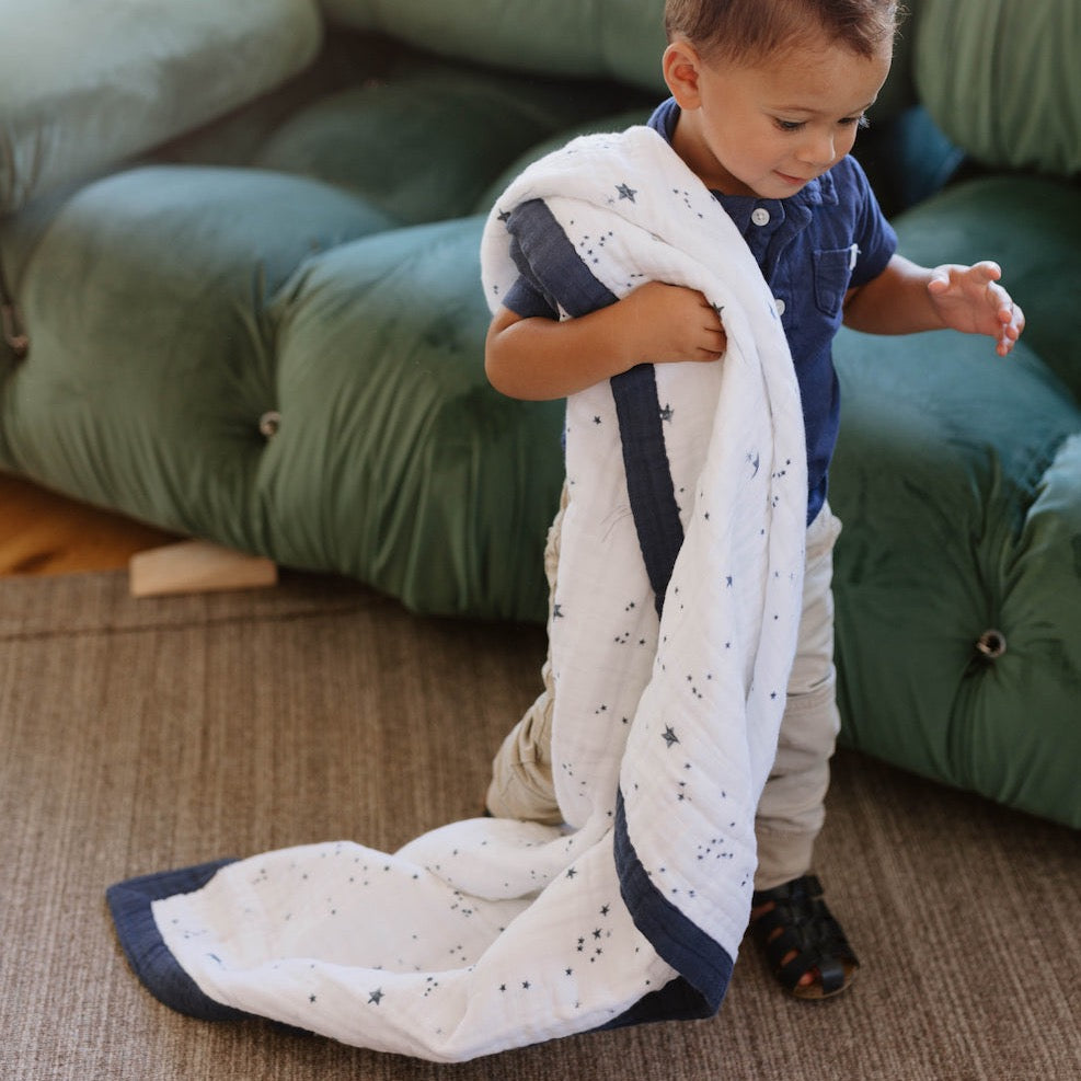 Adorable Little Unicorn Cotton Muslin Baby Quilt - Shooting Stars featuring starry prints, perfect as a gentle muslin blanket.