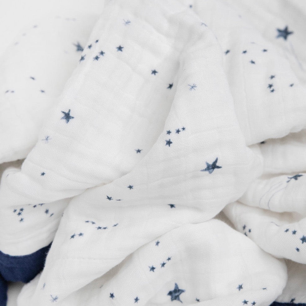 Little Unicorn Cotton Muslin Baby Quilt - Shooting Stars folded neatly, made from breathable muslin blankets for year-round comfort.