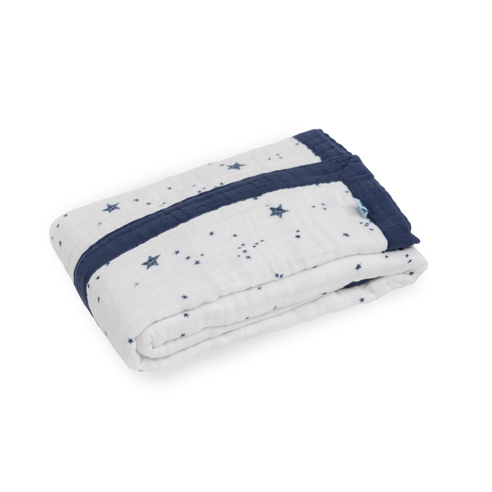 Close-up of Little Unicorn Cotton Muslin Baby Quilt - Shooting Stars showing lightweight muslin texture and celestial design.