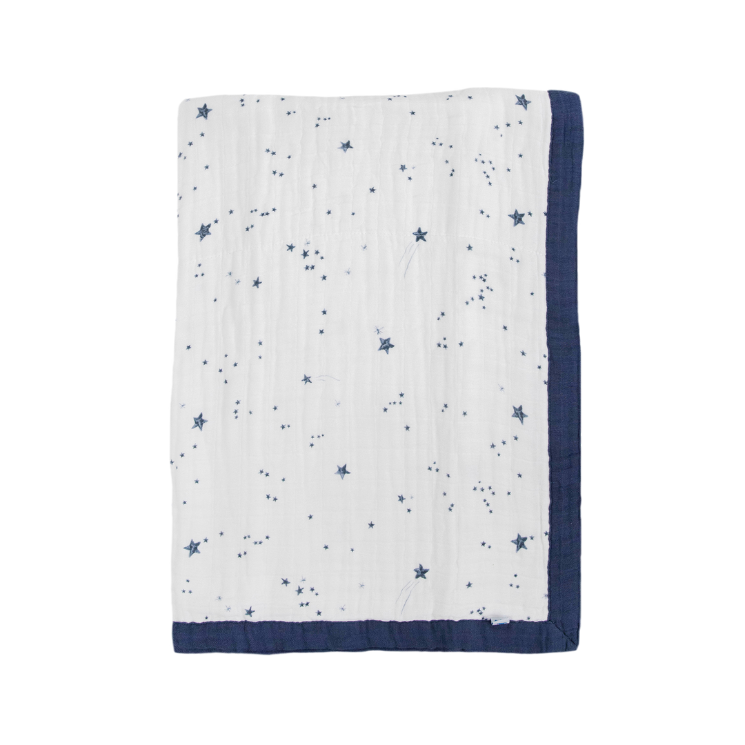 Little Unicorn Cotton Muslin Baby Quilt - Shooting Stars displayed in soft tones, a dreamy baby blanket for cozy nights.