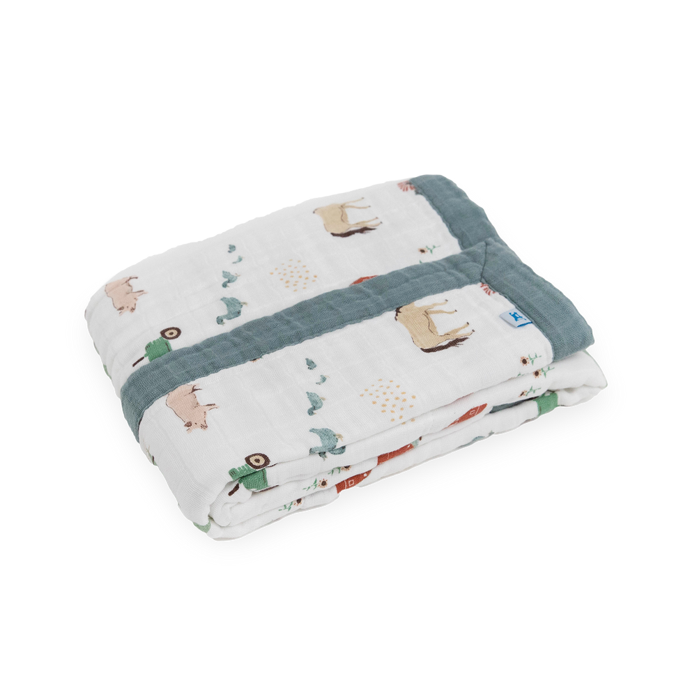Close-up of the Little Unicorn Cotton Muslin Baby Quilt - Farmyard highlighting breathable layers of premium muslin for comfort.