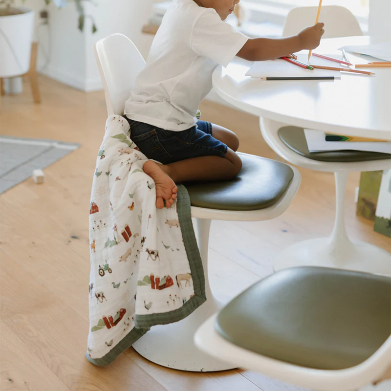 Adorable farm-themed Little Unicorn Cotton Muslin Baby Quilt - Farmyard, a must-have muslin blanket for nursery or stroller use.