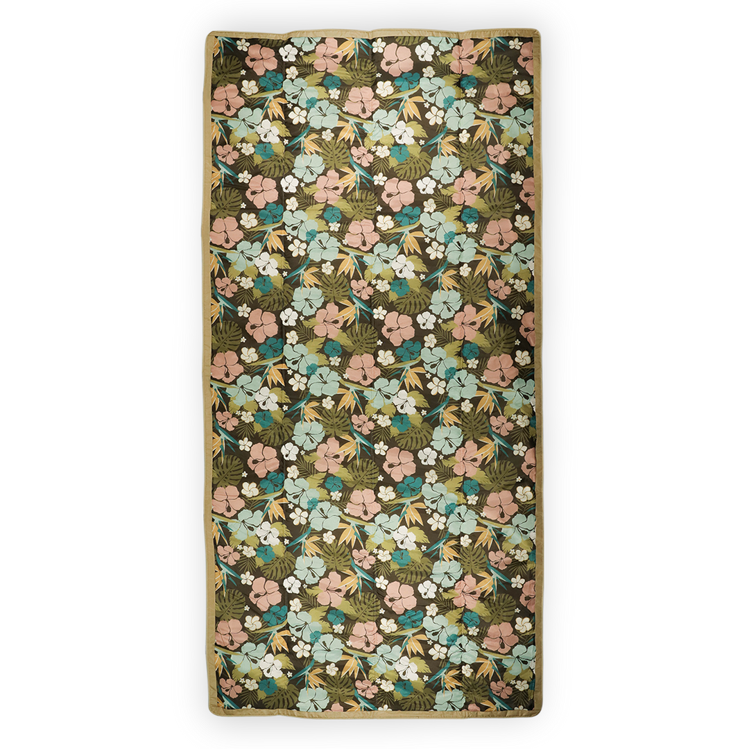 Little Unicorn’s Hibiscus waterproof outdoor blanket, lightweight and durable for travel and outdoor adventures.