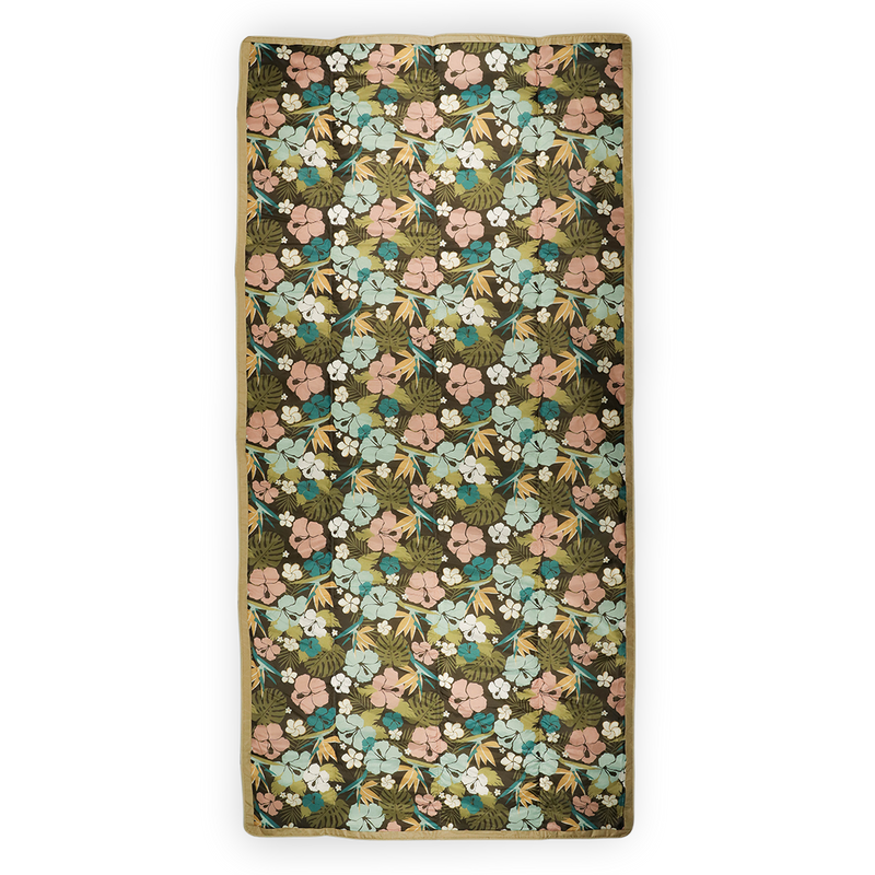 Little Unicorn’s Hibiscus waterproof outdoor blanket, lightweight and durable for travel and outdoor adventures.