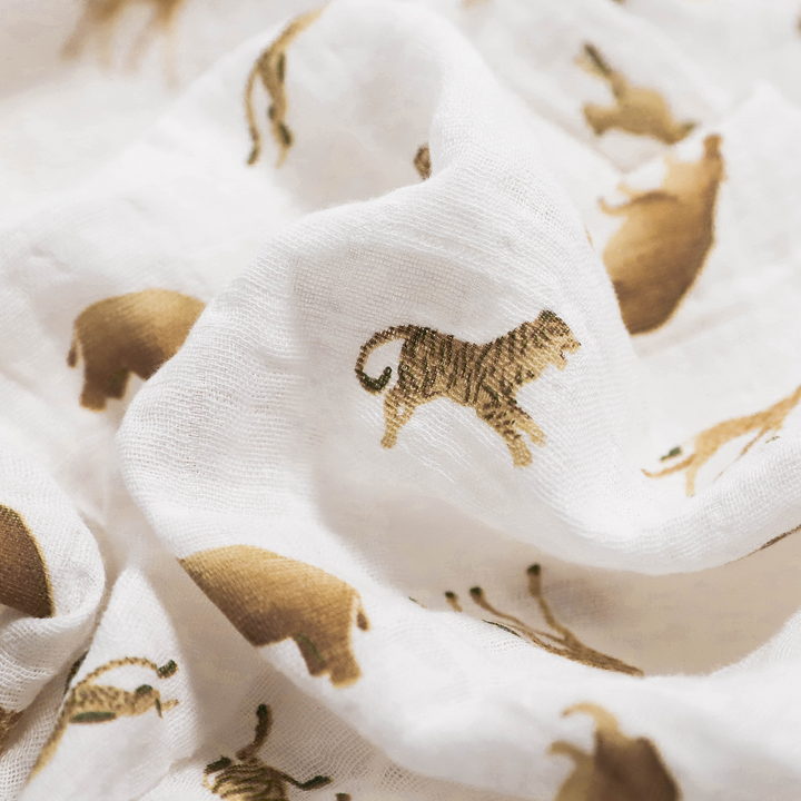 Wrap your baby in comfort with Little Unicorn Animal Crackers Muslin Swaddle, perfect muslin blankets.