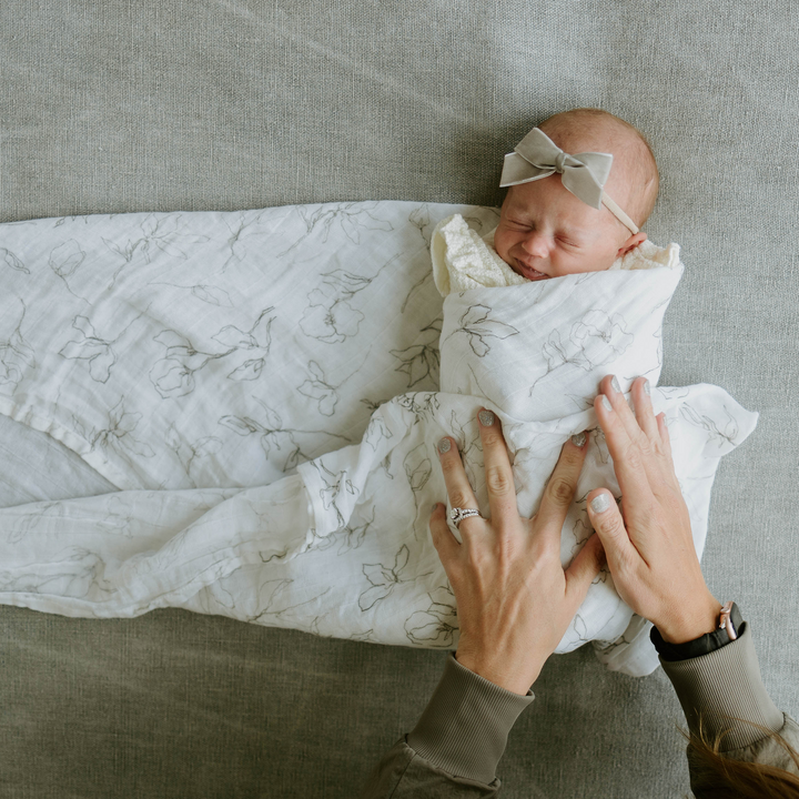 Soft and breathable muslin for swaddling, Little Unicorn Organic Cotton Pencil Floral Swaddle Blanket.