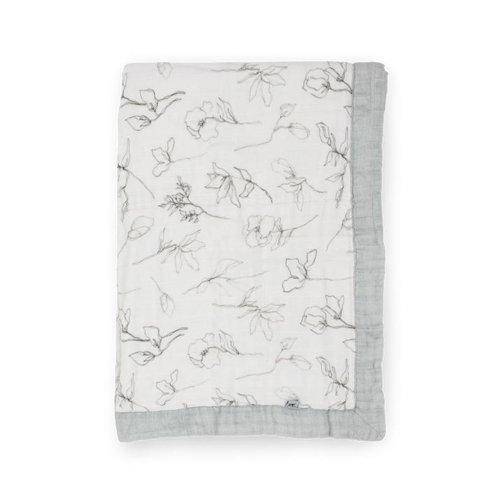 Little Unicorn Organic Cotton Muslin Baby Quilt - Pencil Floral neatly folded, a cozy and stylish baby blanket made for daily snuggles.